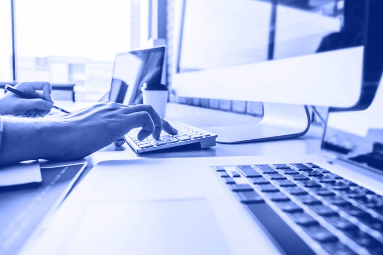 Person Typing on a Keyboard